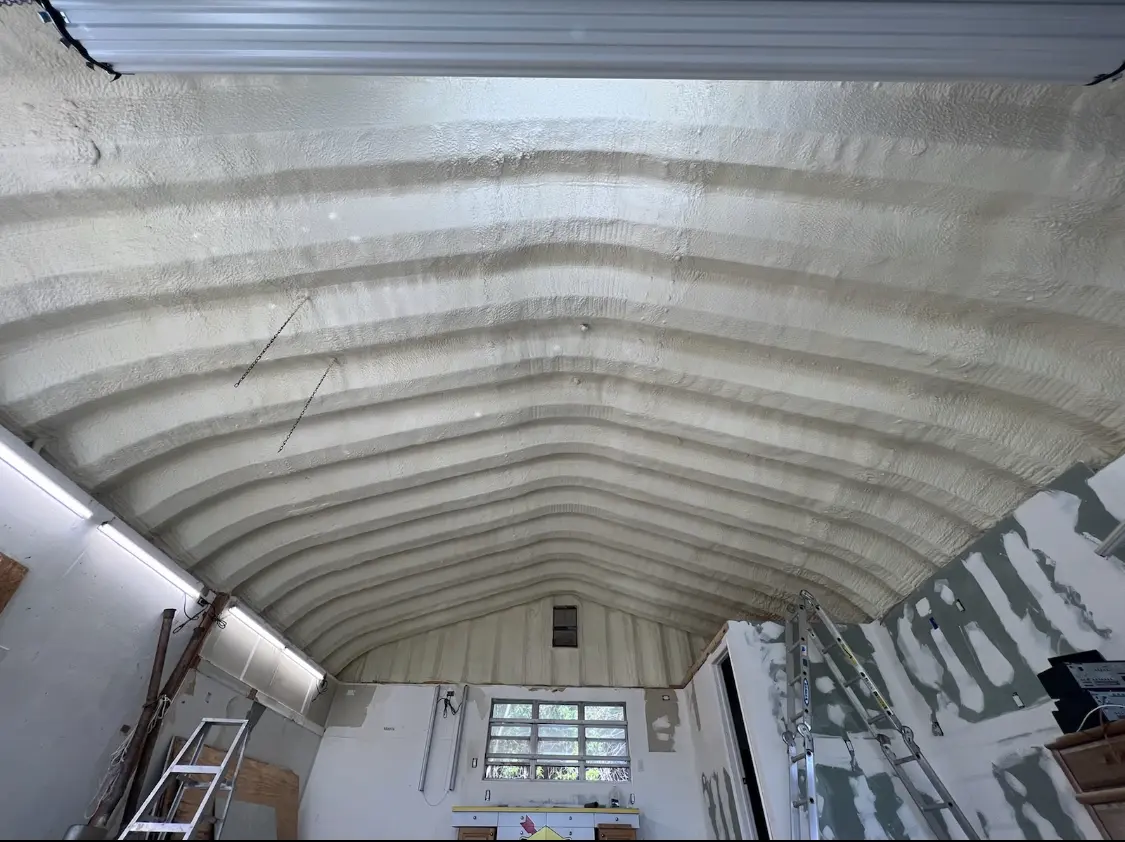 Spray polyurethane foam applied to the underside of a metal roof deck in Fortuna